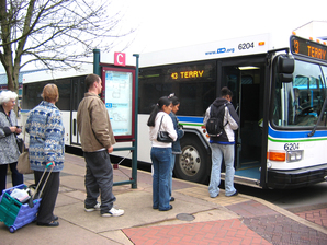 riders boarding at station