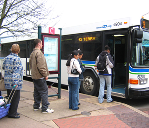 riders boarding at station