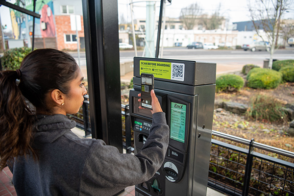 Person using ticket machine