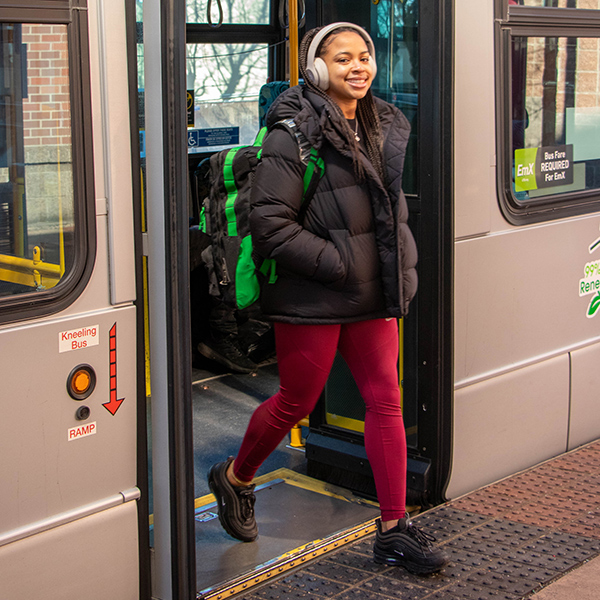 person exiting EmX showcasing level platform