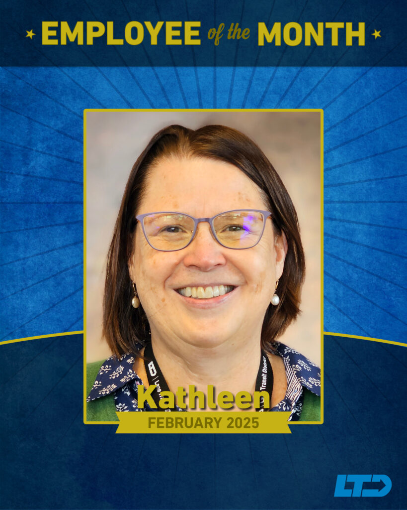 Portrait of Kathleen, smiling and wearing glasses, recognized as Employee of the Month for February 2025 by LTD.