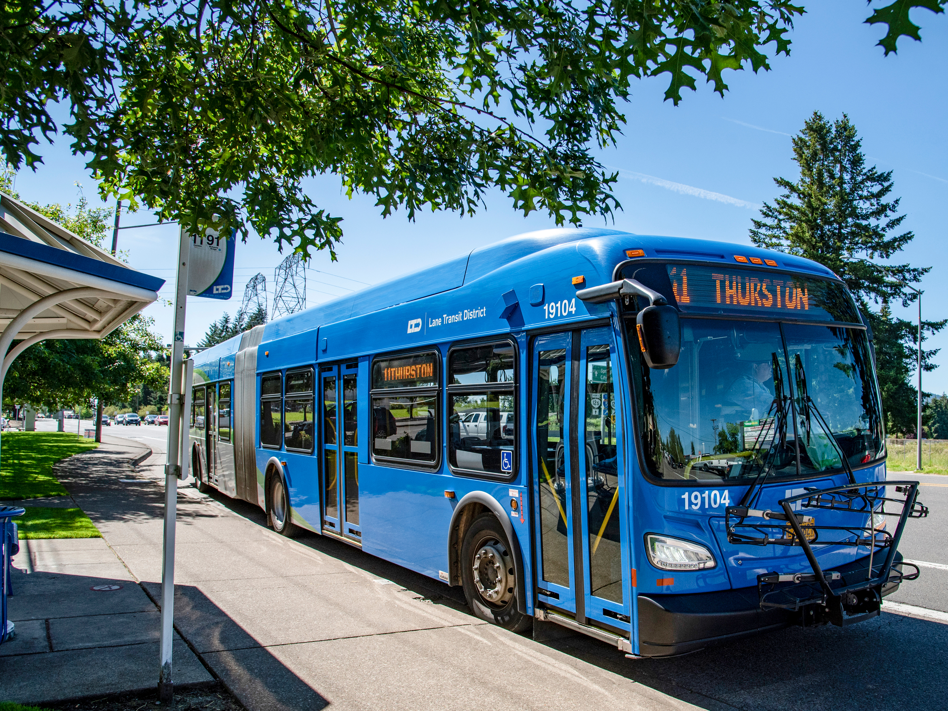 A blue city bus labeled 
