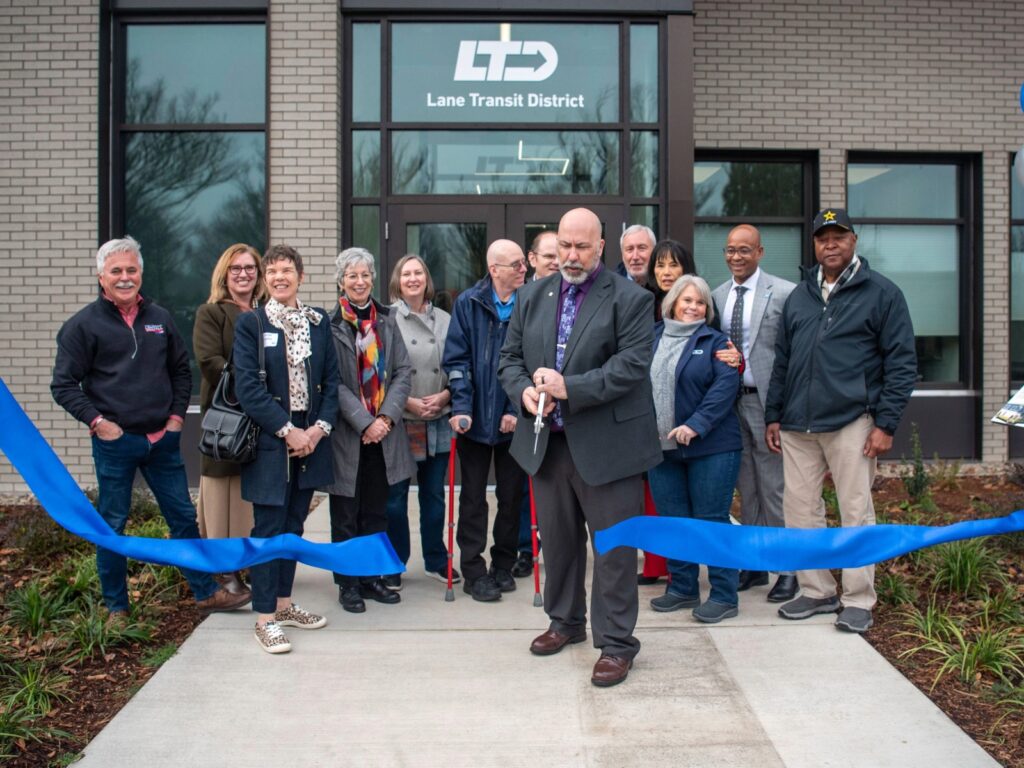 A group of people standing in front of a building.