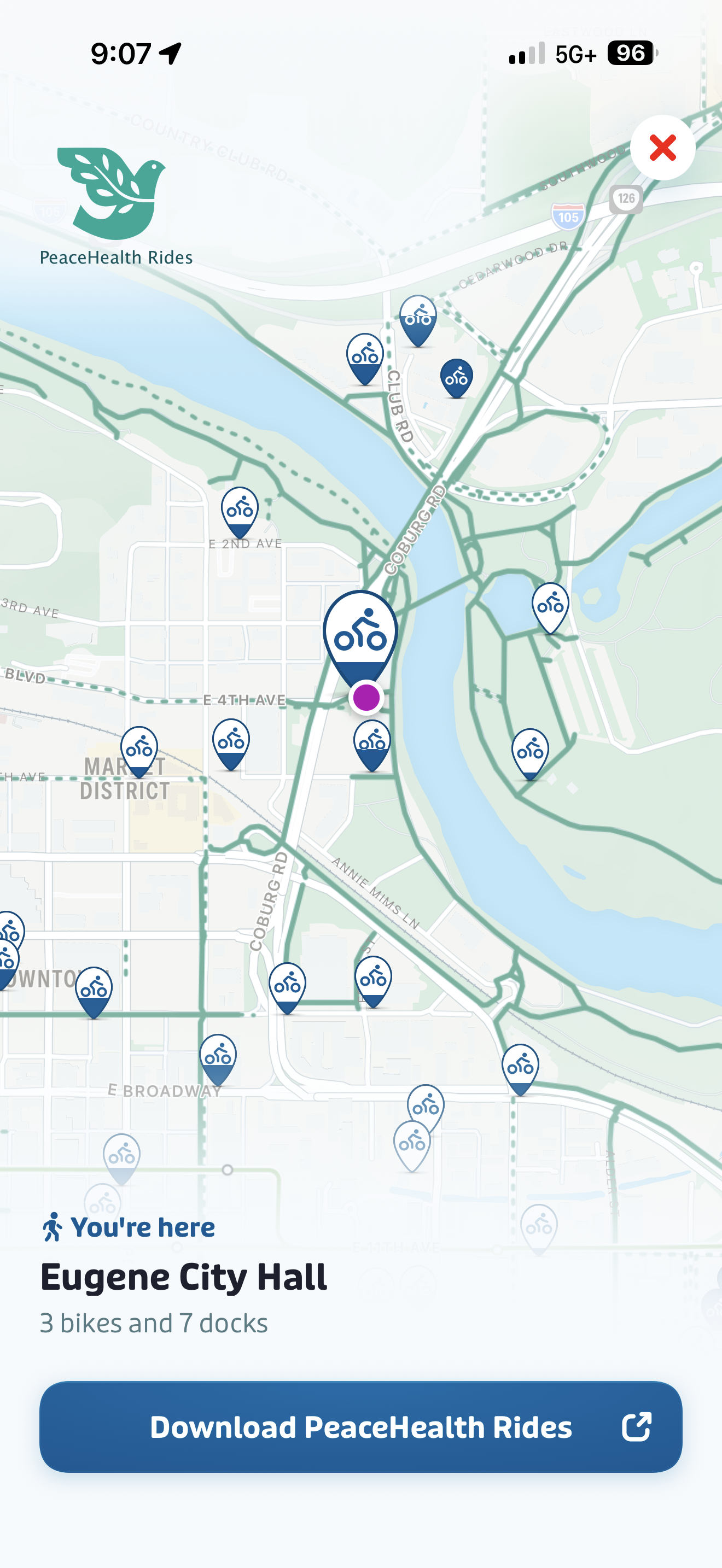 A map screen shows available PeaceHealth Rides bikes and docks near Eugene City Hall, with a highlighted location and a button to download the PeaceHealth Rides app.