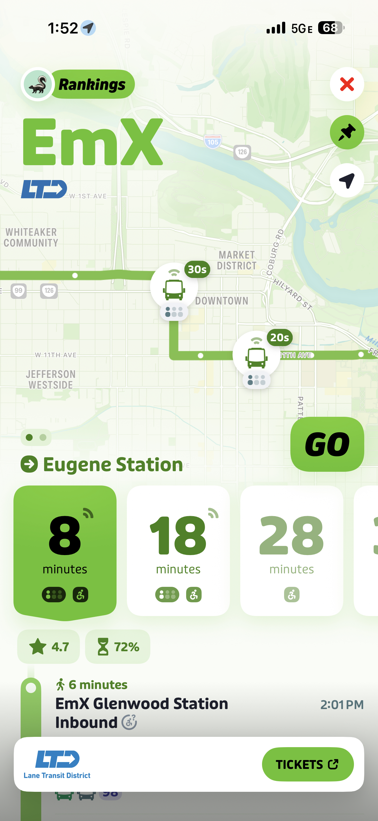 Screenshot of a transit app showing EmX bus wait times at Eugene Station with options for buses arriving in 8, 18, and 28 minutes, along with a map and ticket purchase button.