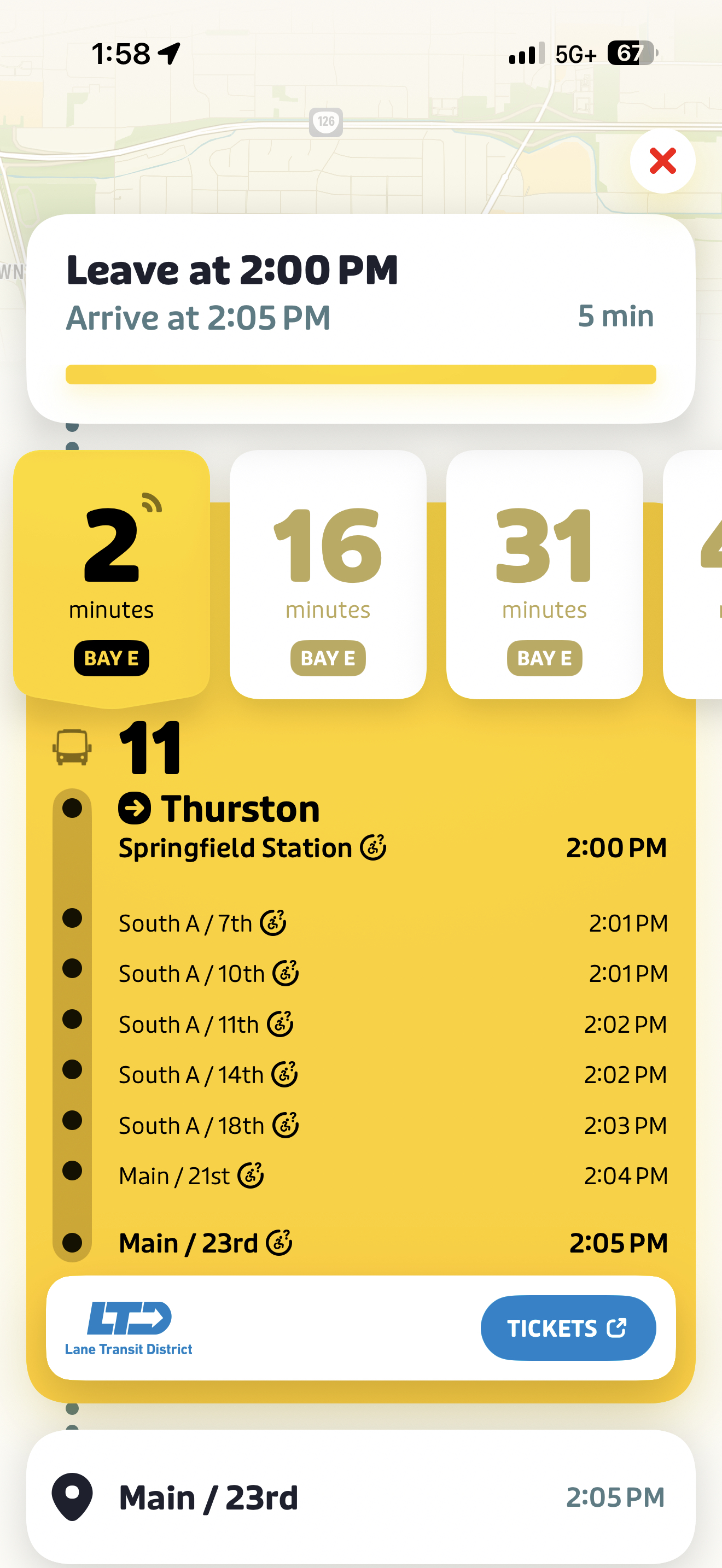 Bus schedule app screenshot showing Route 11 to Thurston, leaving Springfield Station in 2 minutes with arrival times at various stops listed, and ticket options at the bottom.