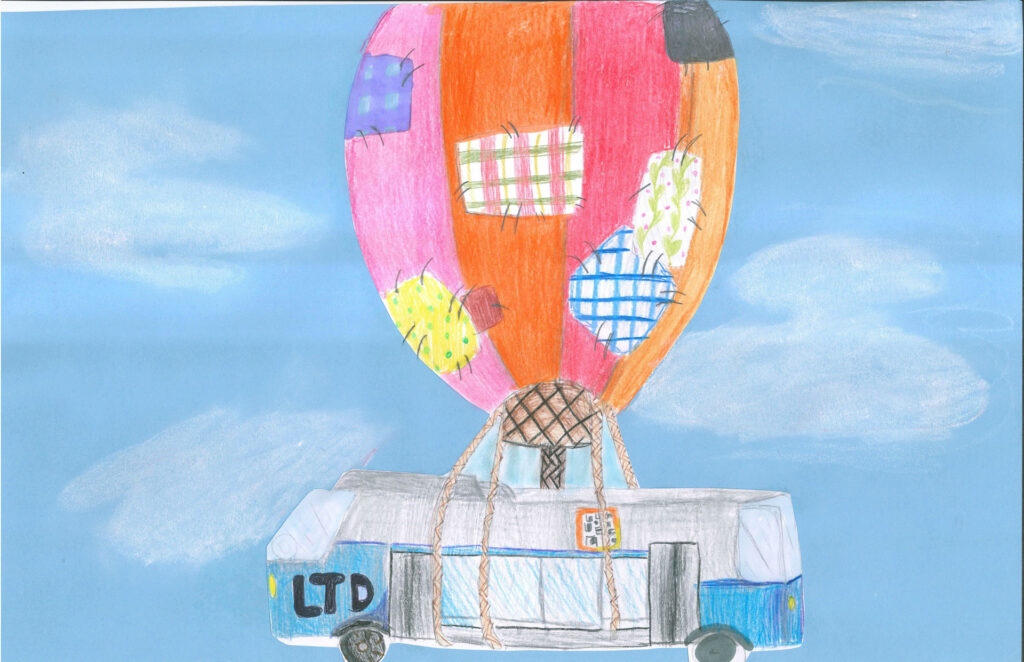 A colorful hot air balloon with patchwork panels lifts a bus labeled "LTD" in the sky with ropes; blue sky and clouds in the background.