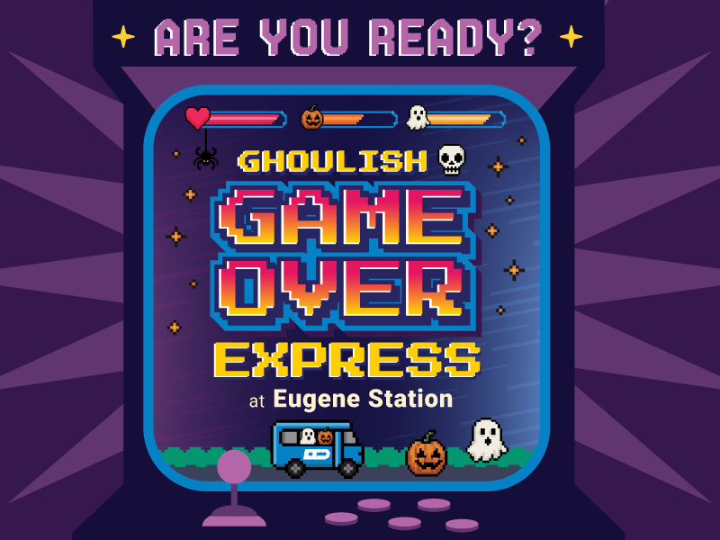 Arcade game screen with “Ghoulish Game Over Express at Eugene Station,” Halloween icons, and a pixel car with pumpkins and a ghost.